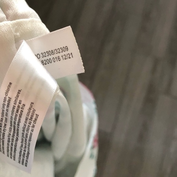 Eloquii|White chiffon floral halter jumpsuit with wide leg, open leg detail•••22 - Picture 13 of 17